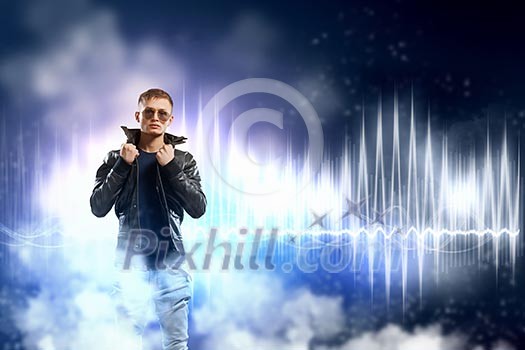 Image of young man rock musician in lights Image of young man rock musician in lights