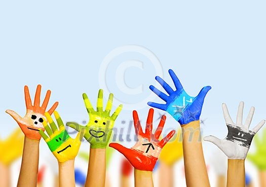 Image of human hands in colorful paint with smiles Image of human hands in colorful paint with smiles