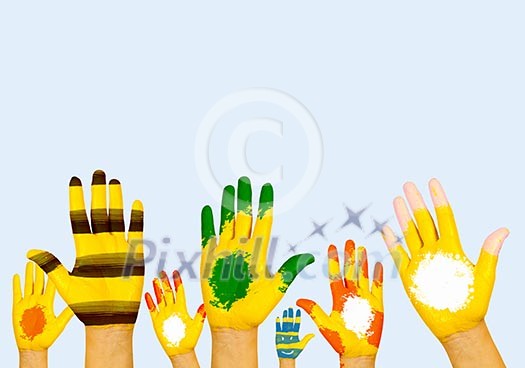 Image of human hands in colorful paint with smiles Image of human hands in colorful paint with smiles