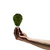Image of human hand holding bulb with earth planet inside. Elements of this image are furnished by NASA
