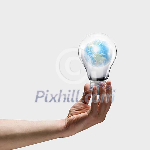 Image of human hand holding bulb with earth planet inside. Elements of this image are furnished by NASA Image of human hand holding bulb with earth planet inside. Elements of this image are furnished by NASA