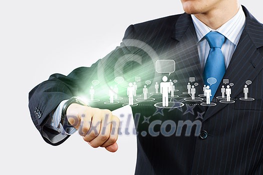 Businessman looking at wristwatch. Media technologies and innovations Businessman looking at wristwatch. Media technologies and innovations