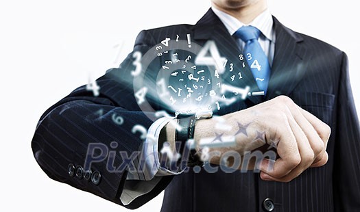 Businessman looking at wristwatch. Media technologies and innovations Businessman looking at wristwatch. Media technologies and innovations