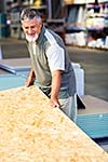 Senior man buying construction wood in a  DIY store