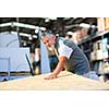 Senior man buying construction wood in a  DIY store