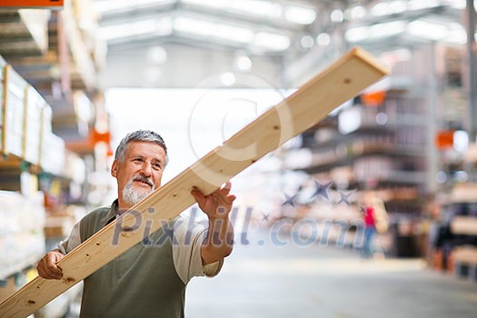 Man buying construction wood in a  DIY store