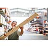 Man buying construction wood in a  DIY store