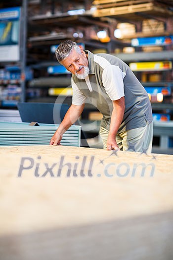 Man buying construction wood in a DIY store Man buying construction wood in a DIY store
