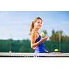 Portrait of a pretty young tennis player with copyspace