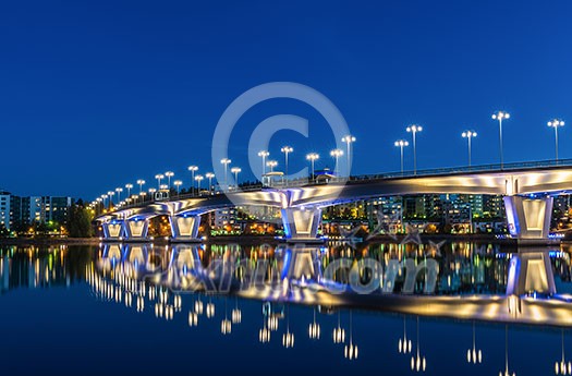 Brightly lit bridge over river Brightly lit bridge over river