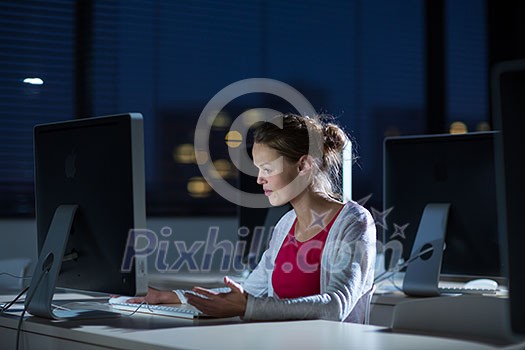 Pretty, young female college student using a desktop computer/pc in a college library (shallow DOF; color toned image) Pretty, young female college student using a desktop computer/pc in a college library (shallow DOF; color toned image)