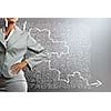 Body of businesswoman drawing business strategy sketches