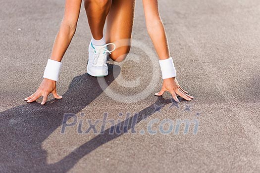 Bottom view of young sport woman in start pose Bottom view of young sport woman in start pose
