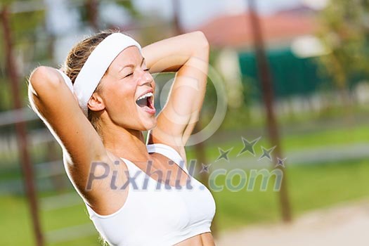 Young attractive sport girl in white sport wear in park Young attractive sport girl in white sport wear in park
