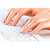 Close up of female hands typing on keyboard