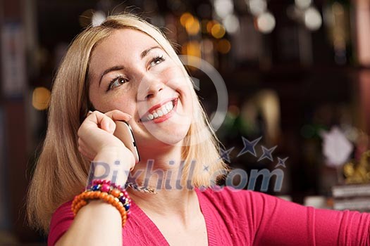 Young attractive lady at bar talking on phone Young attractive lady at bar talking on phone