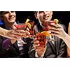 Young attractive people of four having cocktail party