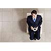 Top view of businessman sitting on chair