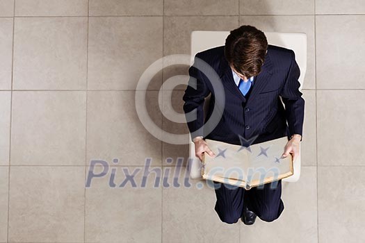 Top view of businessman sitting on chair Top view of businessman sitting on chair