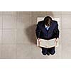 Top view of businessman sitting on chair