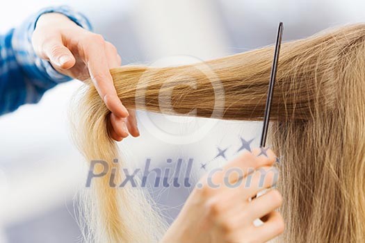 Young woman in chair at barbers and hairdresser Young woman in chair at barbers and hairdresser