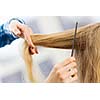 Young woman in chair at barbers and hairdresser