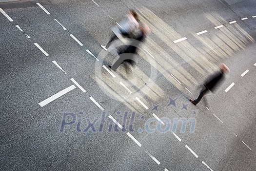 City business people crossing a street - motion blurred abstract background City business people crossing a street - motion blurred abstract background