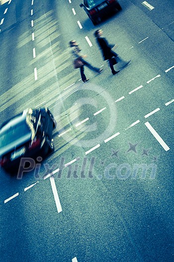 City business people crossing a street - motion blurred abstract background City business people crossing a street - motion blurred abstract background