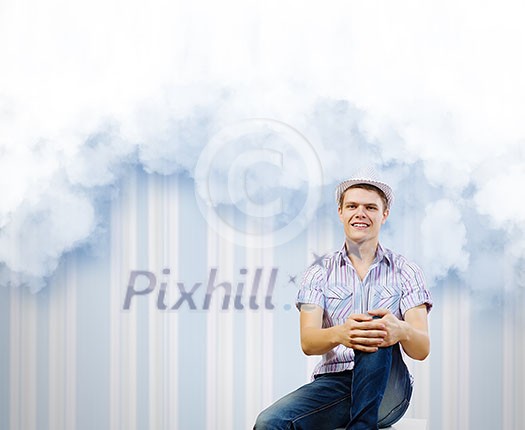Young man in casual dreaming about future Young man in casual dreaming about future