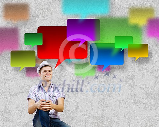 Young man in casual sitting and thinking. Creativity concept Young man in casual sitting and thinking. Creativity concept