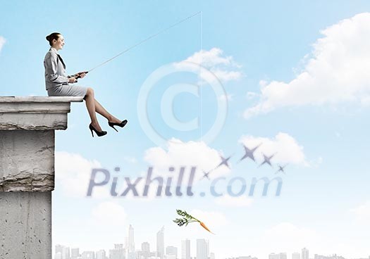 Businesswoman fishing with rod on top of building Businesswoman fishing with rod on top of building