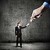 Close up of hand giving money to businessman