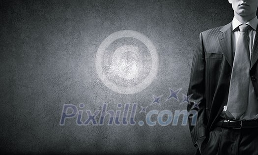 Close up of businessman with hands in pockets Close up of businessman with hands in pockets