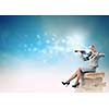 Young businesswoman sitting on pile of books and playing violin