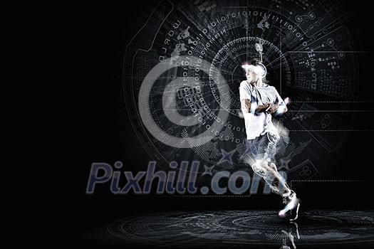 Young running man against digital media background Young running man against digital media background