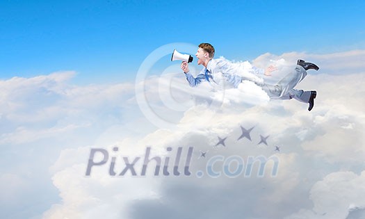 Young businessman with megaphone flying high in sky Young businessman with megaphone flying high in sky