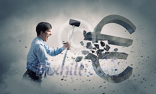Young businessman crashing with hammer stone euro symbol Young businessman crashing with hammer stone euro symbol