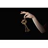 Close up of woman hand holding golden key