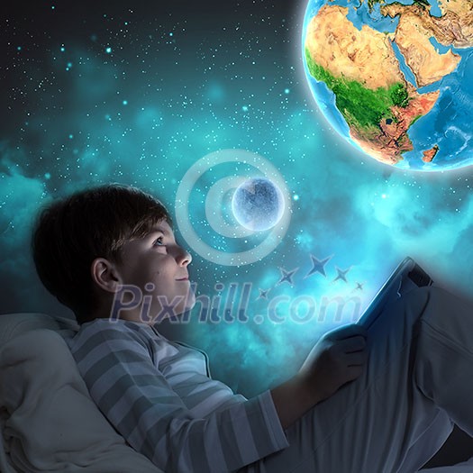 Boy sitting in bed and dreaming. Elements of this image are furnished by NASA Boy sitting in bed and dreaming. Elements of this image are furnished by NASA