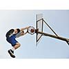 basketball player practicing and posing for basketball and sports athlete concept