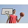 basketball player practicing and posing for basketball and sports athlete concept