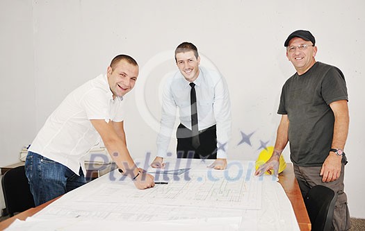 Team of business people in group, architect and engeneer on construciton site check documents and business workflow on new building Team of business people in group, architect and engeneer on construciton site check documents and business workflow on new building