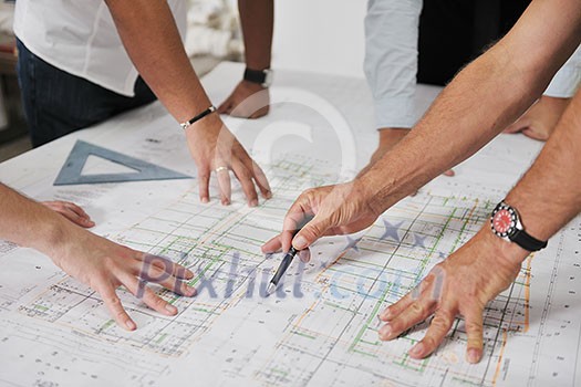 Team of architects people in group on construciton site check documents and business workflow Team of architects people in group on construciton site check documents and business workflow