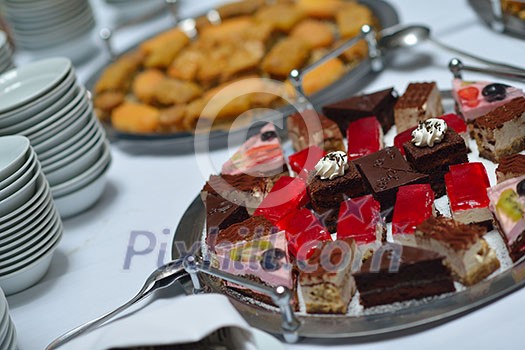 people group catering buffet food indoor in luxury restaurant with meat colorful fruits and vegetables people group catering buffet food indoor in luxury restaurant with meat colorful fruits and vegetables