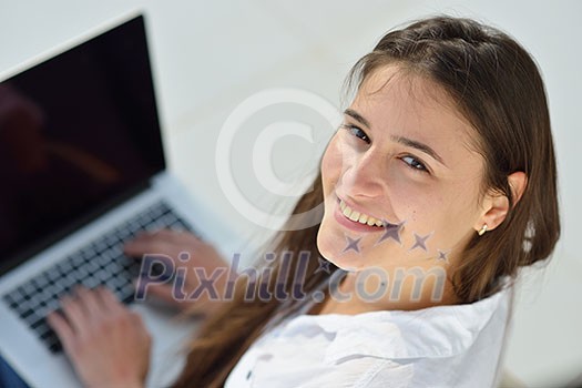 beautiful young woman relax and work on laptop computer modern home office beautiful young woman relax and work on laptop computer modern home office
