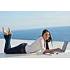beautiful young woman relax and work on laptop computer modern  home office