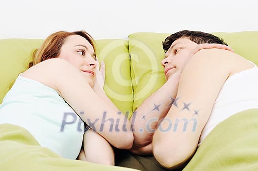 happy young couple in bed at morning happy young couple in bed at morning