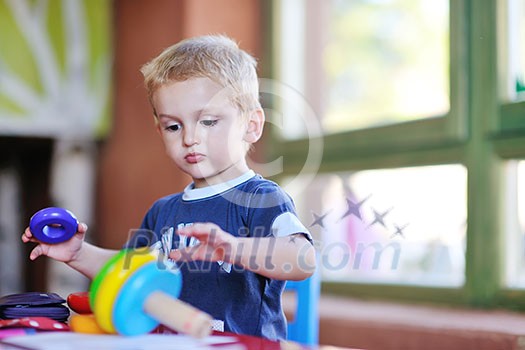 happy little child play game and have fun, education lessons in colorful kinder garden playground indoors happy little child play game and have fun, education lessons in colorful kinder garden playground indoors