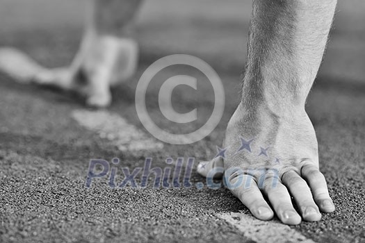 healthy young man at start line ready for run race and win healthy young man at start line ready for run race and win