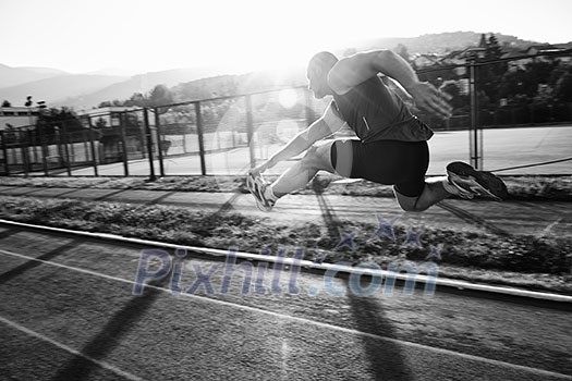 young healthy man run on athletic race sport track and representing concept of sort and speed young healthy man run on athletic race sport track and representing concept of sort and speed